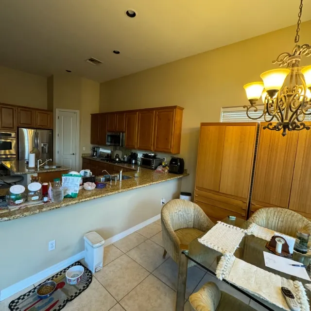 Builder Grade Kitchen With Yellow Stained Cabinets